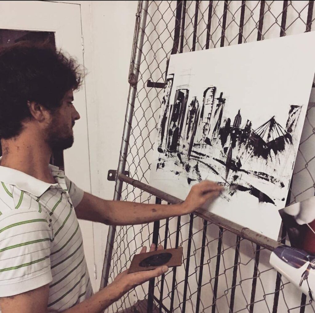 Fine artist Riaan Pretorius painting at a creative gathering in Durban CBD