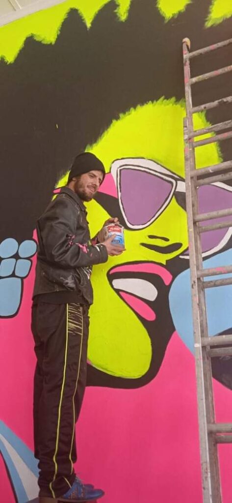 Whilst painting a mural in Woodstock, Cape Town at the Woodstock Hub, 170 Victoria road